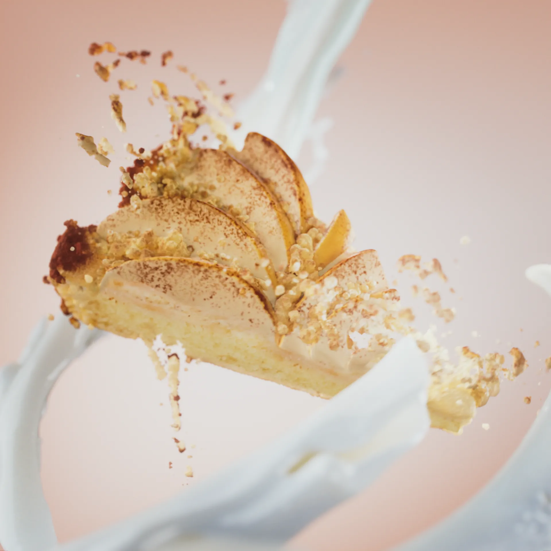 Image of a slice of apple pie that magically starts crumbling. Swirls of cream surround the cake. Still image from an animation made for Ingman Cake Ice Creams.