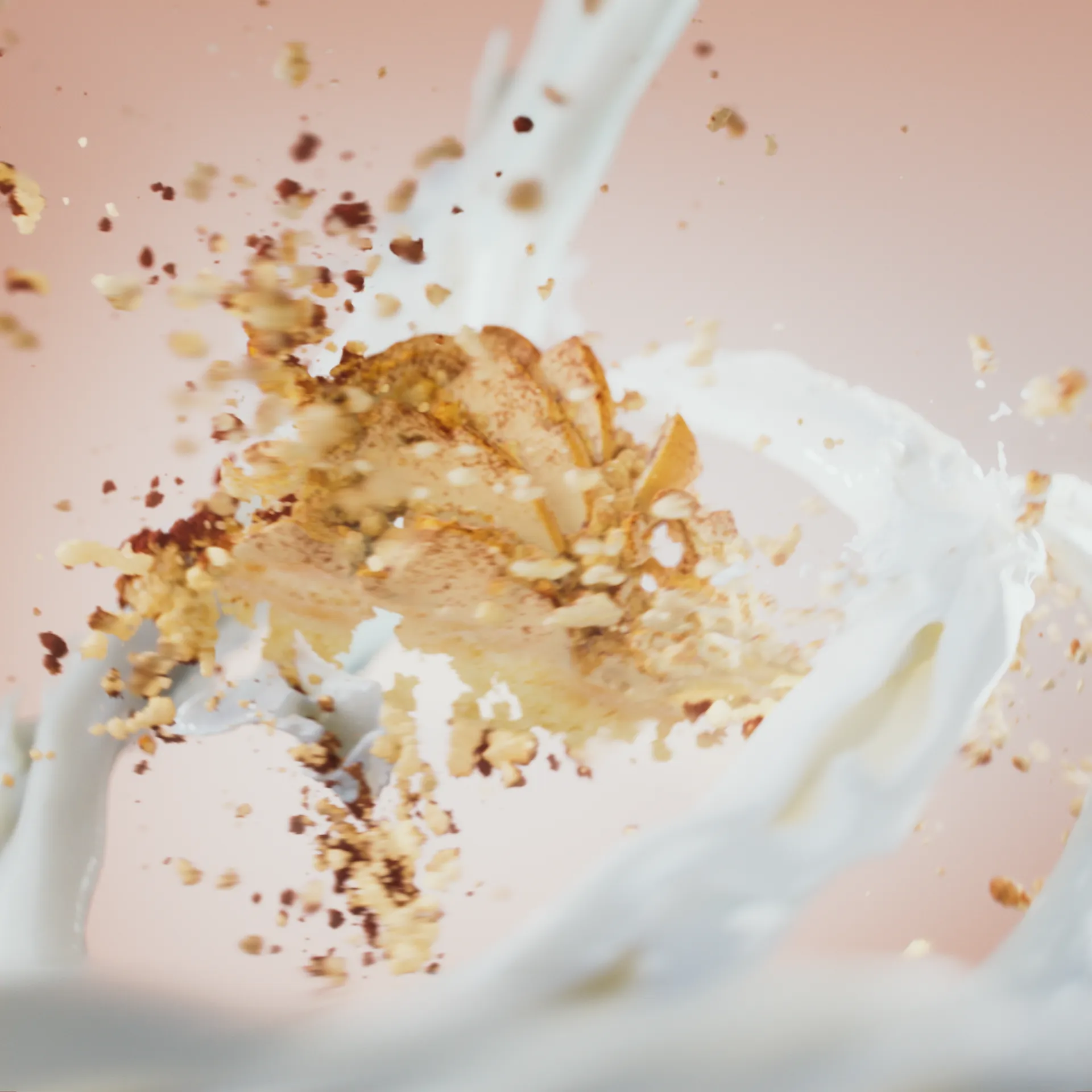 Image of a slice of apple pie that magically starts crumbling. Swirls of cream surround the cake. Still image from a 3D animation made for Ingman Cake Ice Creams.