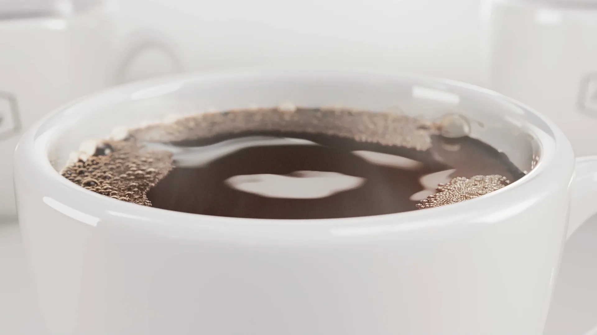 A close up of a cup of coffee with some slight foam and bubbles. Still image from an animation made for Paulig City Coffee ad using liquid simulation and 3D animation.
