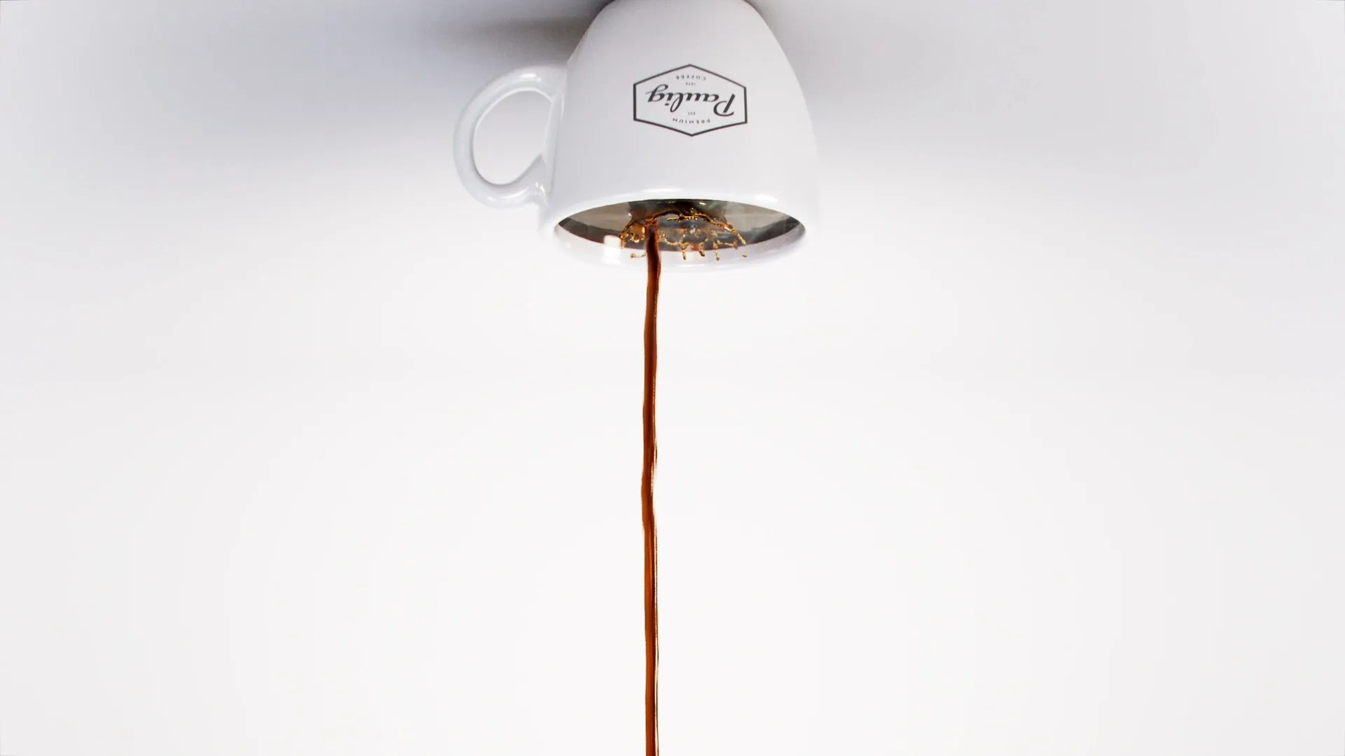Upside down image of a coffee cup, with a stream of coffee flowing into the cup. Still image from an animation made for Paulig City Coffee ad using liquid simulation and 3D animation.