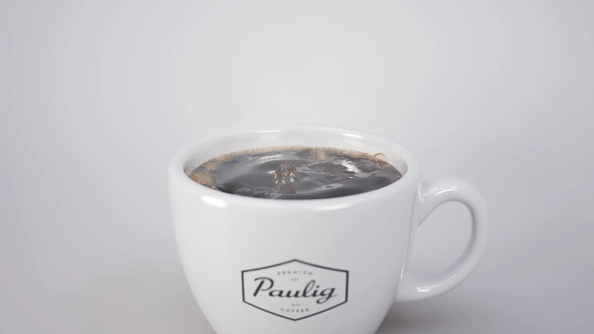 A close up of a cup of coffee with some slight geysir pre-eruption bubbling going on. Still image from an animation made for Paulig City Coffee ad using 3D animation.