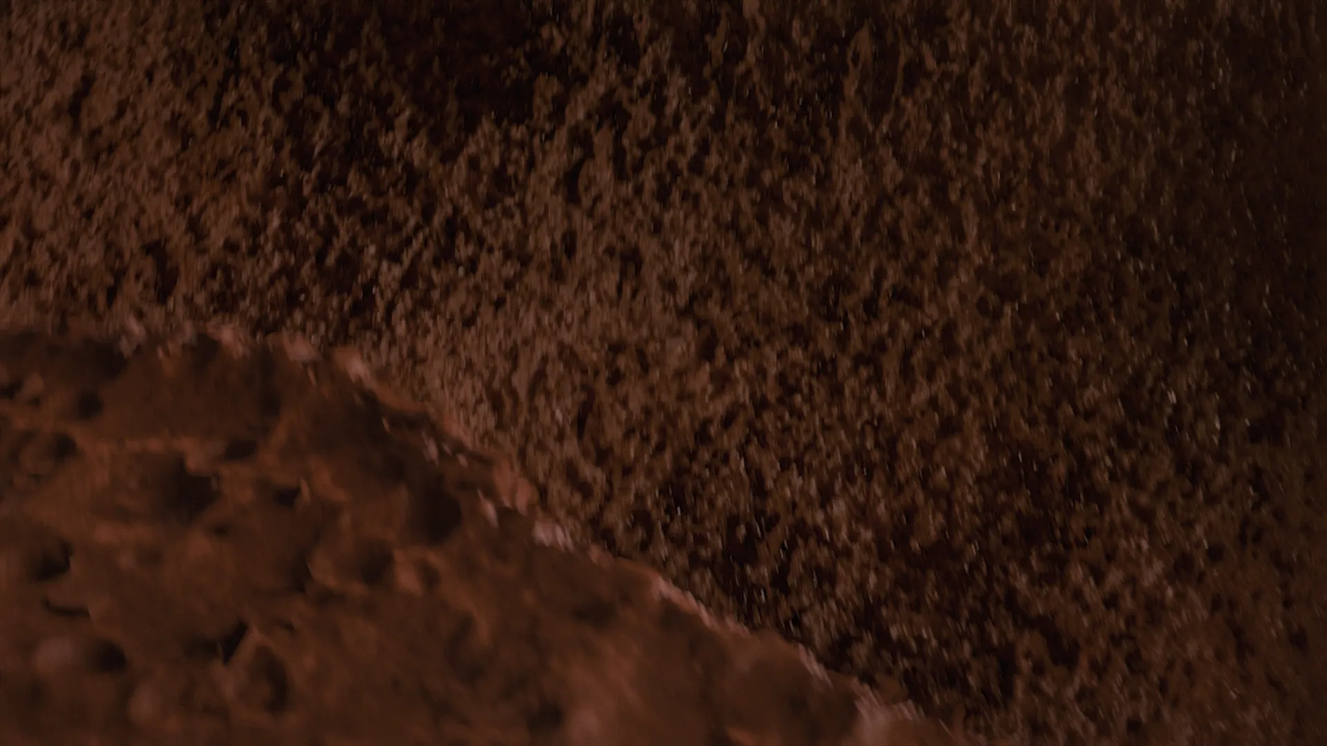 Image of a crater made out of chocolate mousse. Still frame from an animation made for Valio Herkku.