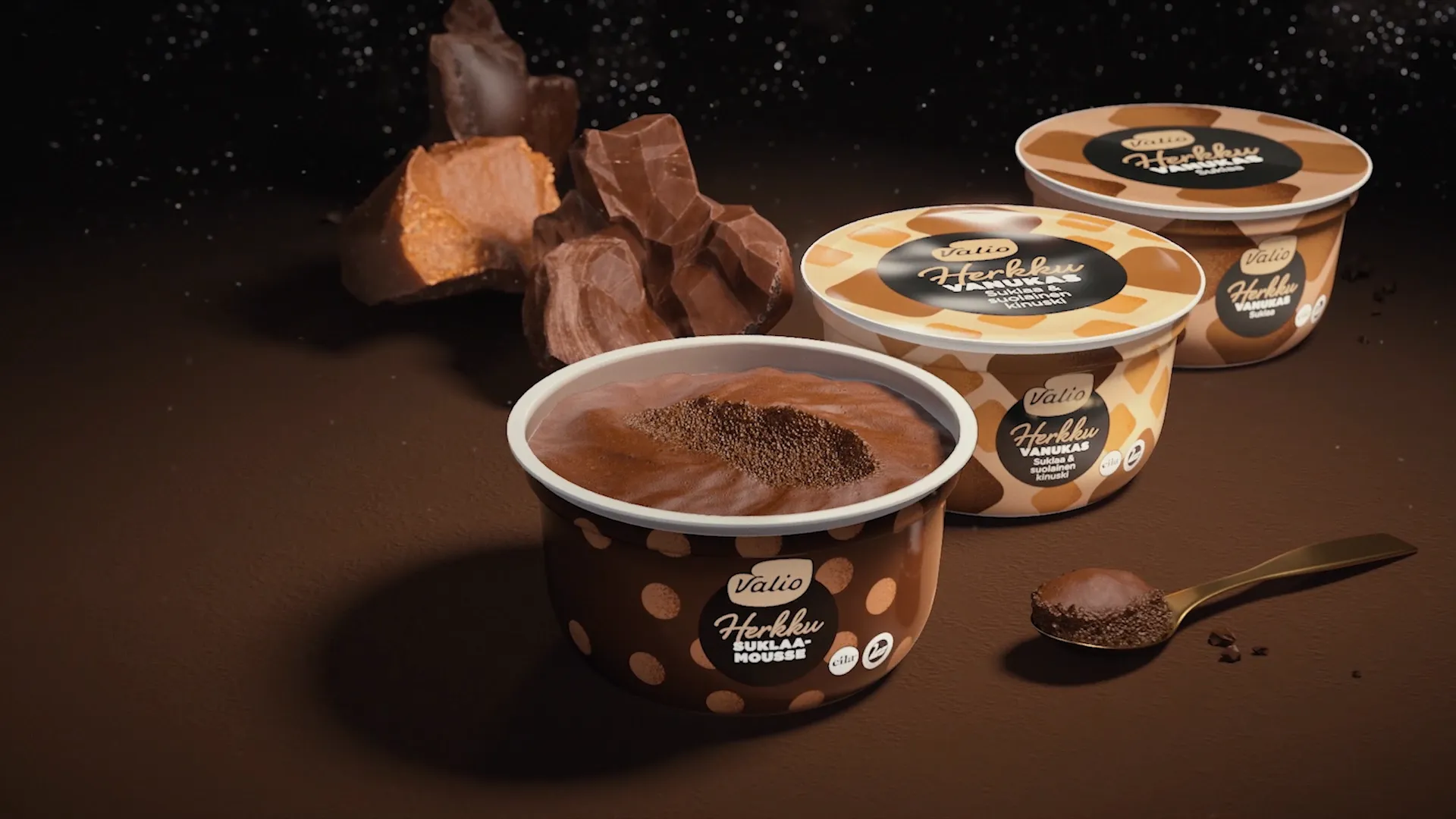 Image of three mousse desserts. Still frame from a 3D chocolate mousse commercial made for Valio Herkku.