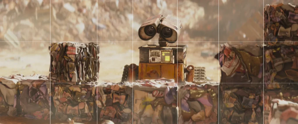An image from the Brink Helsinki Blog Post: Cinematography in Animation, demonstrating the composition technique breaking the pattern using a still frame from the Disney Pixar movie Wall-E