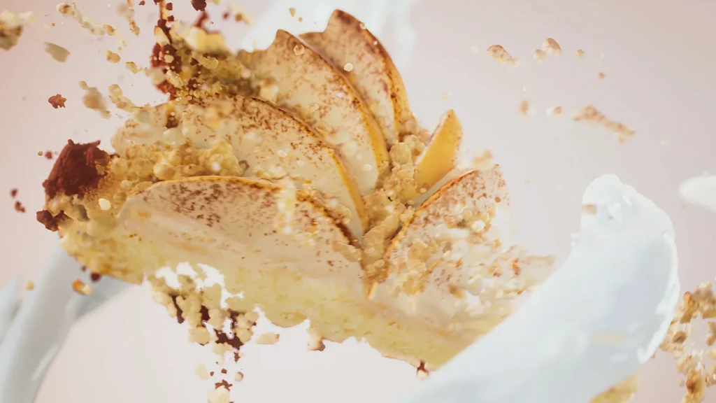 A content image from the Brink Helsinki blog: Simulation in Animation. In the image, there is a still frame from a computer simulated and rendered animation with an apple pie crumbling, surrounded by creamy swirls.